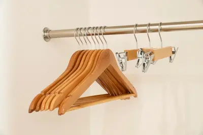 a wooden spoon holder hanging on a wall at GIVE Kagurazaka in Tokyo