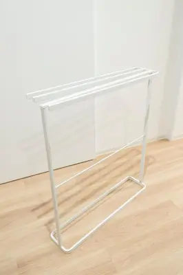 a white table sitting on top of a wooden floor at GIVE Kagurazaka in Tokyo