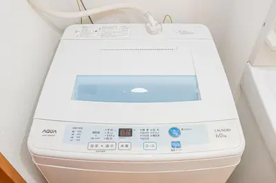 a white toilet in a bathroom with the lid up at KYARA HOTEL \u4e80\u6238b in Tokyo
