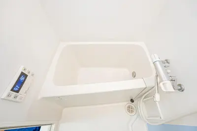 a bathroom with a white sink and aaucet at KYARA HOTEL \u4e80\u6238b in Tokyo