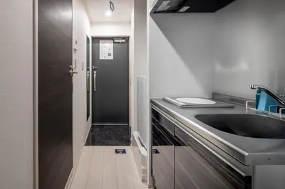 a small kitchen with a sink and a sinkiterator at fl\u30ec\u30b8\u30c7\u30f3\u30b9\u795e\u5bae\u5fa1\u82d1IV in Tokyo