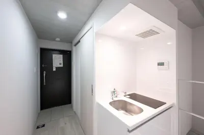 a bathroom with a sink and a mirror at \u30ec\u30d4\u30e5\u30a2\u66f3\u821f\u30ec\u30b8\u30c7\u30f3\u30b9ll in Tokyo