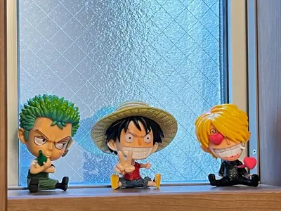 a group of toy figurines sitting on a window sill at Charming New Home Launch: Direct access to Narita & Haneda Airports, Shinjuku, and Disneyland; Close to Asakusa & Akihabara! in Tokyo