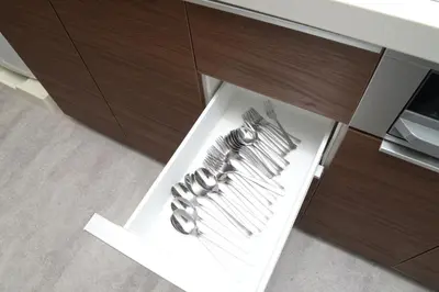 a cabinet with silver utensils on a table at \u548c\u30ce\u6953cottage\u7b2c\u4e8c\u3000\u65b0\u5bbf\u306e2\u968e\u5efa\u30662\u5ba41\u30b7\u30e3\u30ef\u30fc1\u30c8\u30a4\u30ec in Tokyo