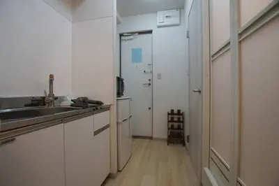 a small kitchen with a sink and a refrigerator at TokyoGuest \u6d5c\u753a in Tokyo