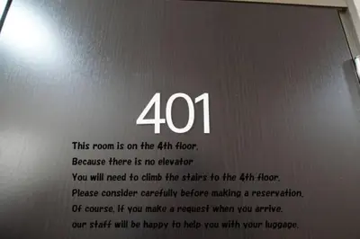 a sign with the number on a laptop at TokyoGuest \u6d5c\u753a in Tokyo