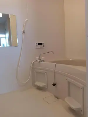 a white bathroom with a sink and a mirror at Tokyo downtown\u7261\u4e39\u838a in Tokyo