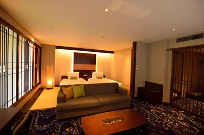 a hotel room with a bed and a couch at Hotel Ryumeikan Ochanomizu Honten in Tokyo