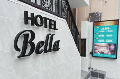 a sign for a hotel bill on a wall at Exquisite business hotel Bella in Tokyo