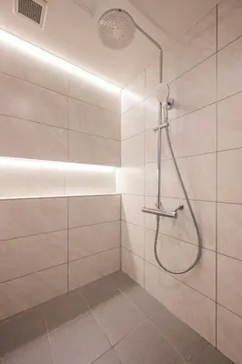 a bathroom with a shower with a shower head at Exquisite business hotel Bella in Tokyo