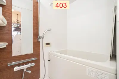 a bathroom with a white tub and a mirror at Downtown Apartment/ SHIBUYA Station 10mins on foot in Tokyo