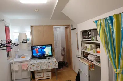 a kitchen with a desk with a computer on it at WOMEN ONLY 3F in Tokyo