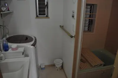 a bathroom with a toilet and a sink and a tub at WOMEN ONLY 3F in Tokyo