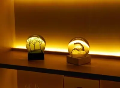 two glass globes on a shelf with a light at Oda hotel Akihabara in Tokyo