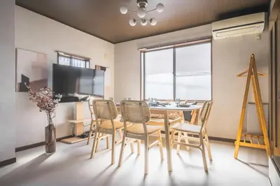 a dining room with a table and chairs at Japandi House Haneda in Tokyo
