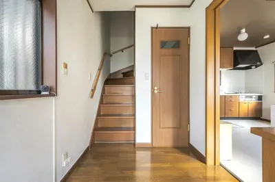 a small apartment with a staircase and a door at Japandi House Haneda in Tokyo