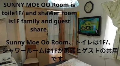 a living room with a tv and a room with a bed at Sunny moe oo in Tokyo