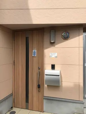a building with a paper dispenser on the side of it at Sunny moe oo in Tokyo