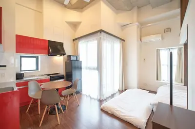 a kitchen with a table and a bed in a room at Kiyosumi SOHO4B, 5th floor, 6th floor - Vacation STAY 20597v in Tokyo