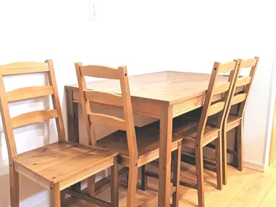 a wooden table with two chairs and a table and a table and chairs at KIK HOUSE-Self Check in- Will send room number and password in Tokyo