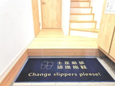a sign on a floor in front of a door with a staircase at KIK HOUSE-Self Check in- Will send room number and password in Tokyo