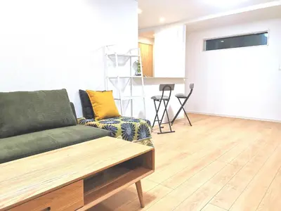 a living room with a couch and a table at KIK HOUSE-Self Check in- Will send room number and password in Tokyo