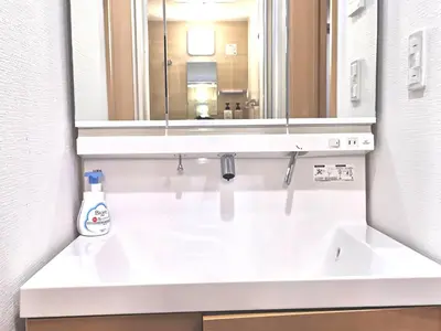 a bathroom with a sink and a mirror at KIK HOUSE-Self Check in- Will send room number and password in Tokyo