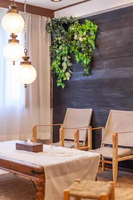a room with two chairs and a table and plants at \u30e9\u30d3\u30c8\u30f3\u30d3\u30eb in Tokyo