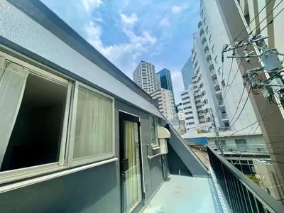 a balcony of a building with windows in a city at home shinjuku west301 in Tokyo