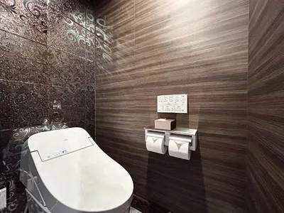 a bathroom with a toilet and a sign on the wall at Hotel BaliBali \u9daf\u8c37 in Tokyo
