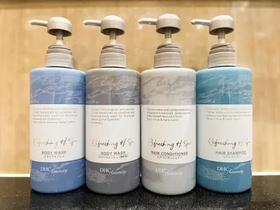 a group of four bottles of water on a counter at Hotel BaliBali \u9daf\u8c37 in Tokyo