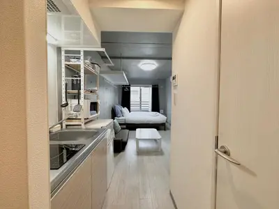 a small room with a kitchen and a living room at Hotel \u30de\u30fc\u30d9\u30e9\u30b9Asakusa #1 in Tokyo