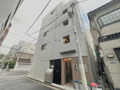 a building with its door open on a street at Hotel \u30de\u30fc\u30d9\u30e9\u30b9Asakusa#LOFT#2 in Tokyo