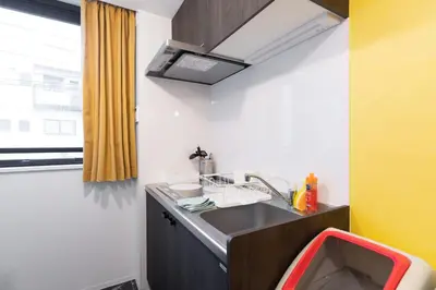 a small kitchen with a sink and a sink at Caesar House Connecting Room 201and202 in Tokyo