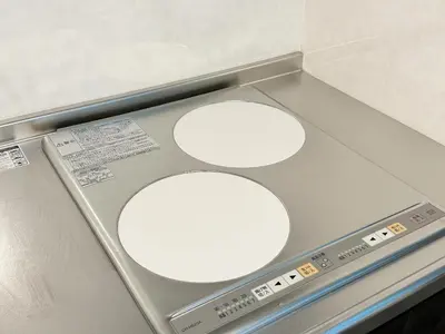 two white circles on a counter with a scale at Caesar House Connecting Room 201and202 in Tokyo