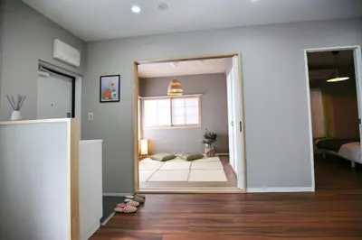 a room with a door open to a living room at QU102 Edogawa Japanese Style Apartment 102 has direct access to Akihabara and Shinjuku, with convenient transportation and free WiFi in Tokyo