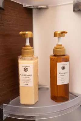 two bottles of soap sitting on a shelf at QU202 Edogawa Japanese Style Apartment 202 has direct access to Akihabara and Shinjuku, with convenient transportation and free WiFi in Tokyo