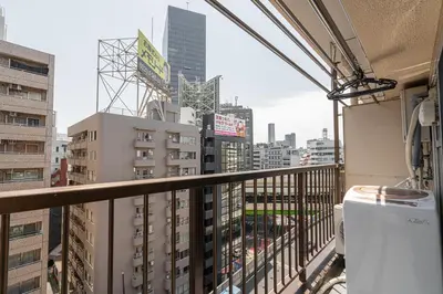 a balcony with a view of a city at Ikebukuro East Exit, 2BR in Tokyo