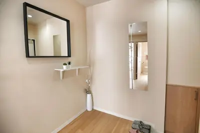 a room with a mirror and a vase on a wall at QU201 Edogawa Japanese Style Apartment 201 has direct access to Akihabara and Shinjuku, with convenient transportation and free WiFi in Tokyo
