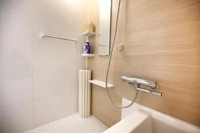a bathroom with a shower and a sink at QU201 Edogawa Japanese Style Apartment 201 has direct access to Akihabara and Shinjuku, with convenient transportation and free WiFi in Tokyo