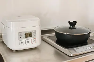a toaster sitting on a stove with a bowl on it at QU201 Edogawa Japanese Style Apartment 201 has direct access to Akihabara and Shinjuku, with convenient transportation and free WiFi in Tokyo