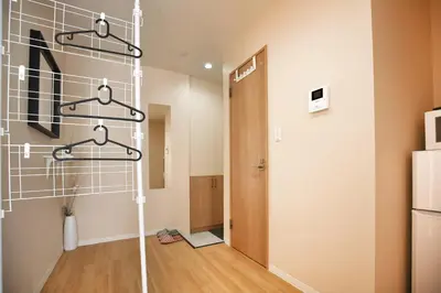 a room with a refrigerator and a hallway at QU201 Edogawa Japanese Style Apartment 201 has direct access to Akihabara and Shinjuku, with convenient transportation and free WiFi in Tokyo