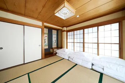 a living room with a couch in a room with windows at \u30db\u30c6\u30eb\u516b\u5e83 in Tokyo