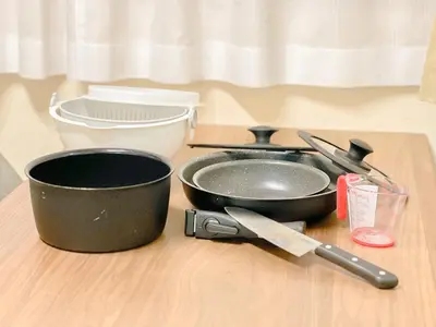 a black frying pan sitting on a table with a knife at Tokyo Skytree Residence Inn (F2) in Tokyo