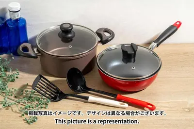 a pot and utensils on a wooden table with a sign at Lega land\u5e61\u30f6\u8c37 in Tokyo