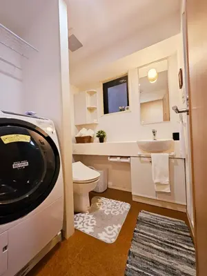 a bathroom with a toilet and a sink at AsahiStay -Shinjuku, Self check in, Well located house in Tokyo