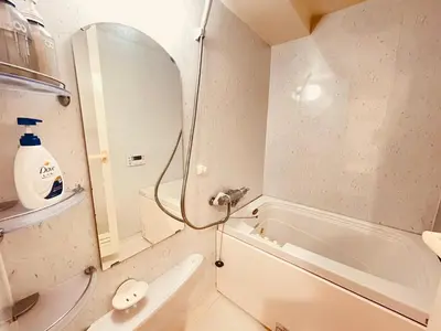 a bathroom with a white tub and a sink and a shower at AsahiStay -Shinjuku, Self check in, Well located house in Tokyo