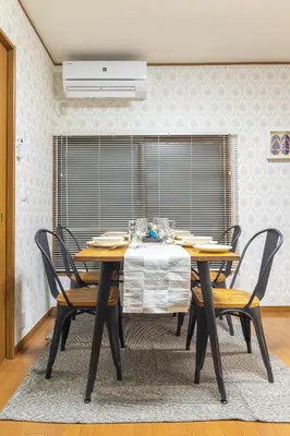 a dining room with a table and some chairs at KiraKira House Elegant 3BR on Yamanote Line in Tokyo