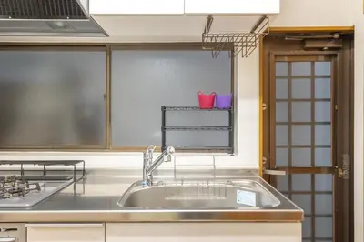 a kitchen with a sink and a window at KiraKira House Elegant 3BR on Yamanote Line in Tokyo