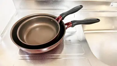 a frying pan sitting in the inside of a stove at JW-One in Tokyo